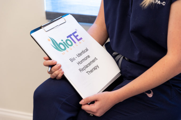 Provider holding clipboard of information about hormone therapy in Myrtle Beach